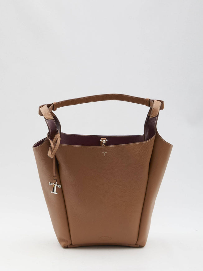 a brown handbag with a handle on a white background