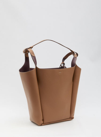 a brown purse with a handle on a white background