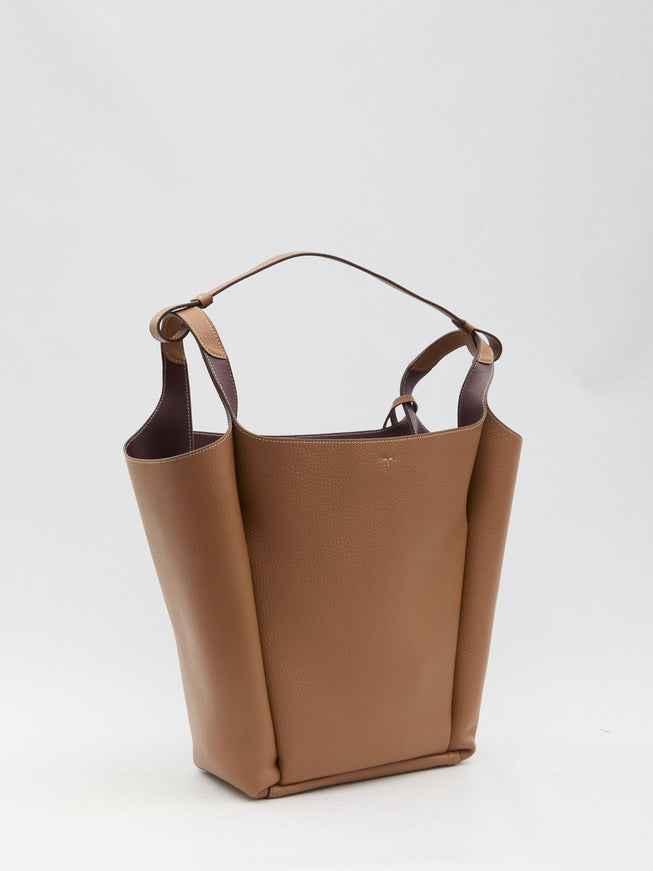 a brown purse with a handle on a white background