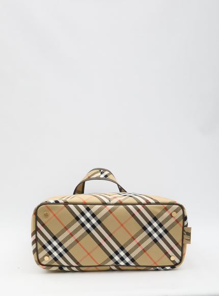 a tan and black checkered bag on a white background