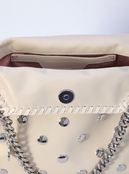 a white purse with a chain strap