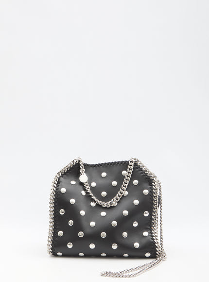 a black purse with white polka dots on it