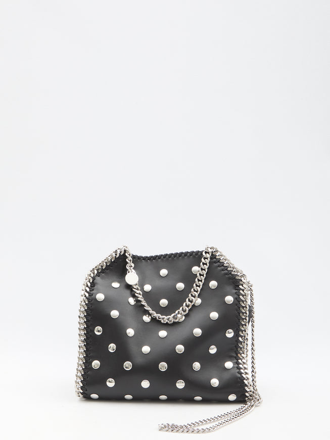 a black purse with white polka dots on it