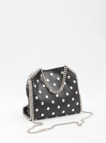 a black purse with white polka dots on it