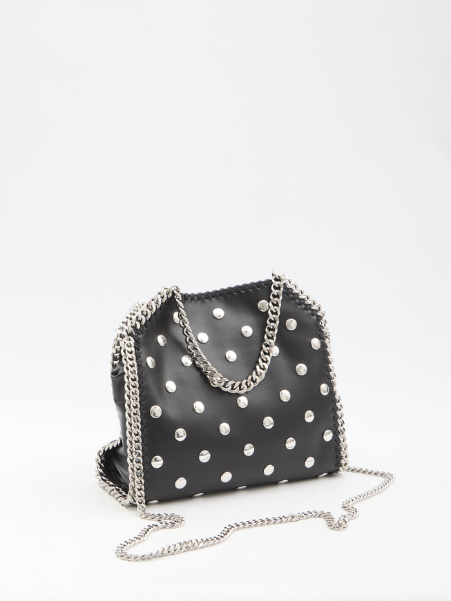 a black purse with white polka dots on it