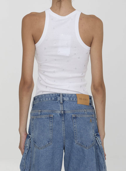 the back of a woman wearing a white tank top