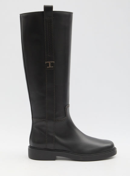 a tall black boot with a zipper on the side