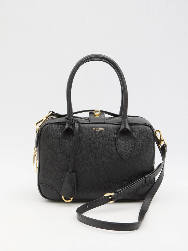 a small black handbag with a strap