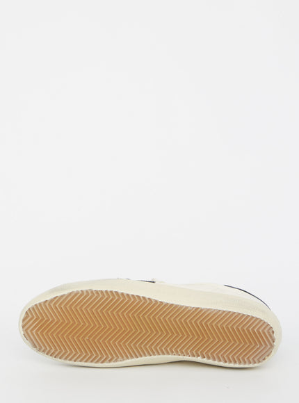 a close up of a person's shoes on a white background