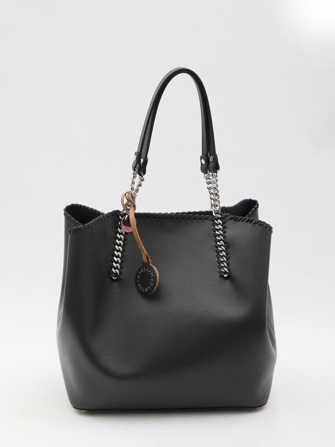 a black handbag with a wooden handle