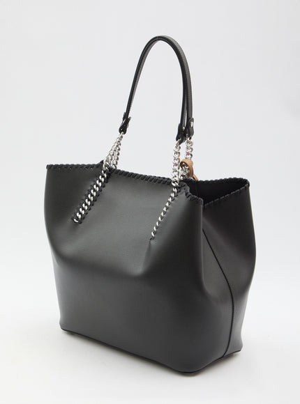 a black purse with a chain hanging from it