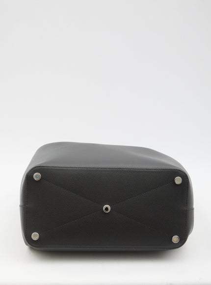 a black leather case sitting on top of a white table