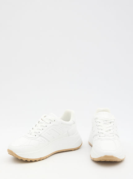 a pair of white shoes on a white background