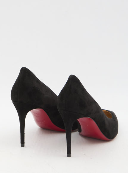 a pair of black shoes with red soles