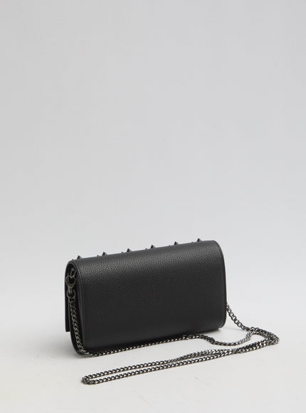 a black purse with a chain hanging from it