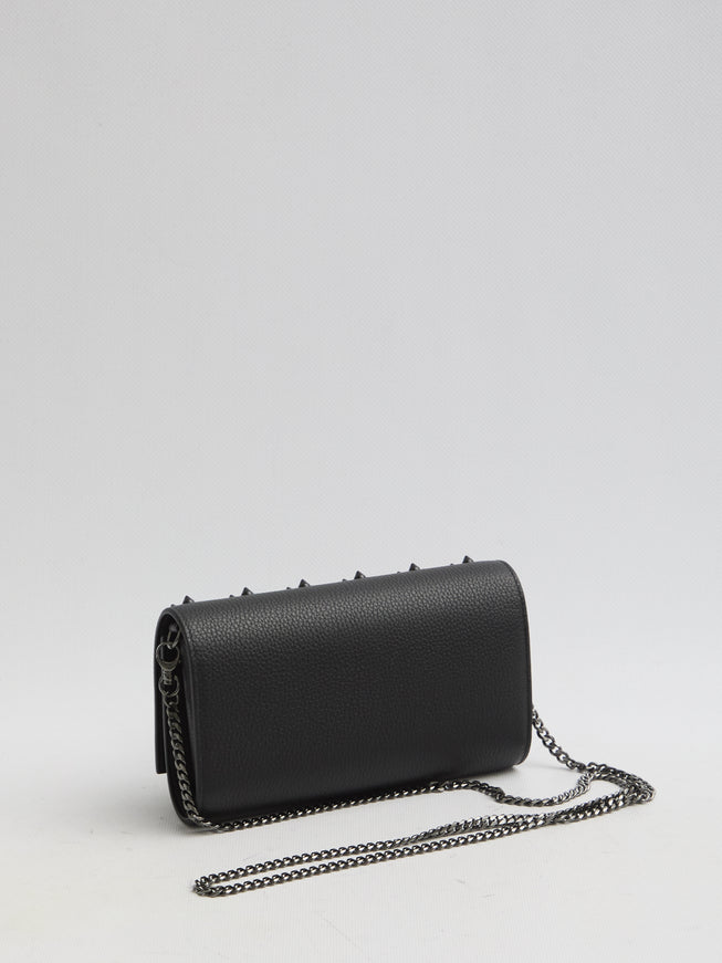 a black purse with a chain hanging from it