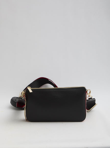 a small black purse with a red strap