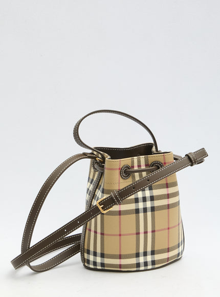 a small bucket bag with a strap on a white background