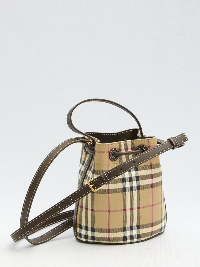 a small bucket bag with a strap on a white background