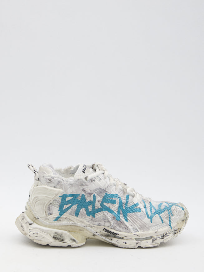 a pair of sneakers with graffiti on them