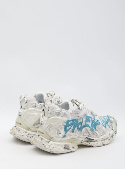 a pair of sneakers with graffiti painted on them