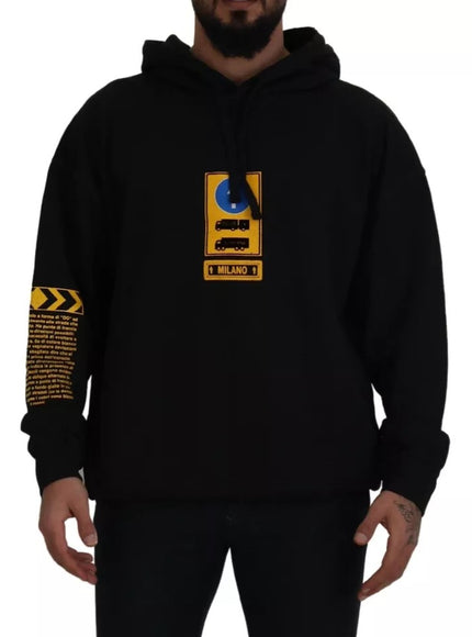 a man wearing a black hoodie with a yellow and black logo