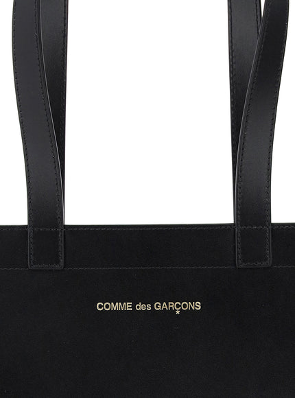 Comme Des Garcons Wallet leather tote bag with logo