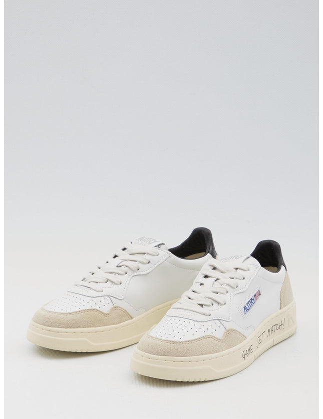 Autry Medalist Low Leather Sneakers in Ivory and Black - Ellie Belle