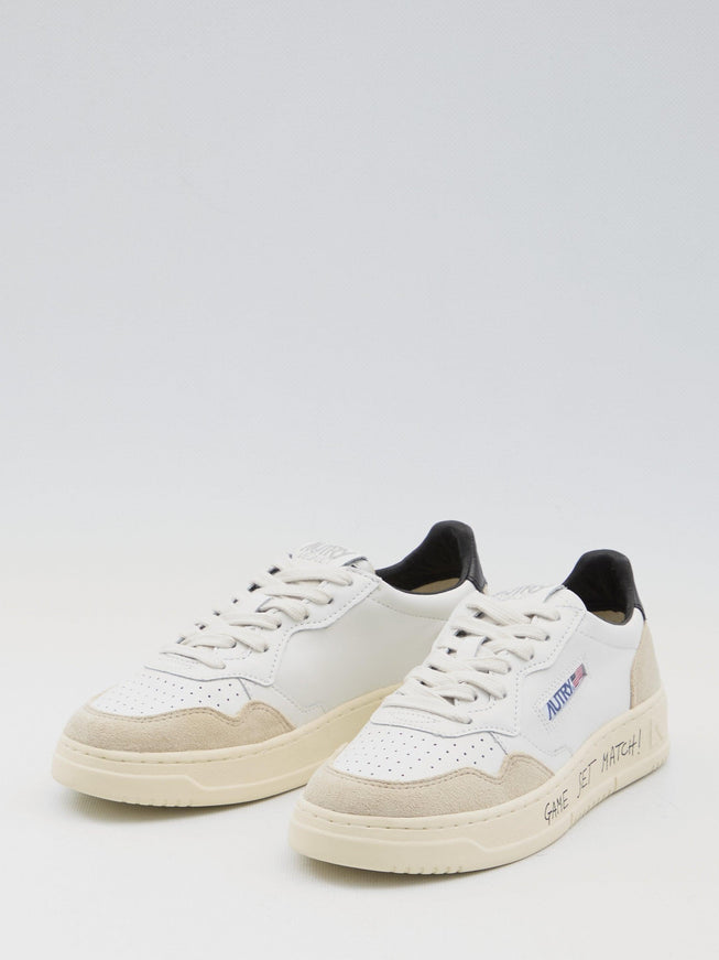 Autry Medalist Low Leather Sneakers in Ivory and Black - Ellie Belle