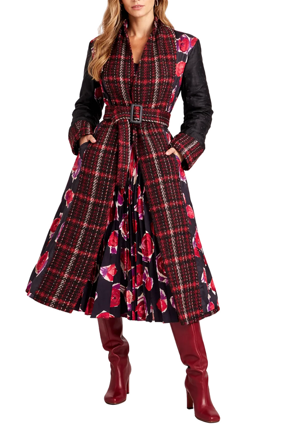 Woman wearing a Marni plaid coat with red floral pattern and red boots on a white background