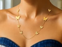 Collier papillon gradué en or jaune 14 carats