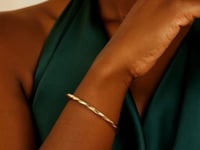 Bracelet jonc fin torsadé brillant en or jaune 14 carats