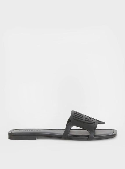 a pair of black sandals on a white background