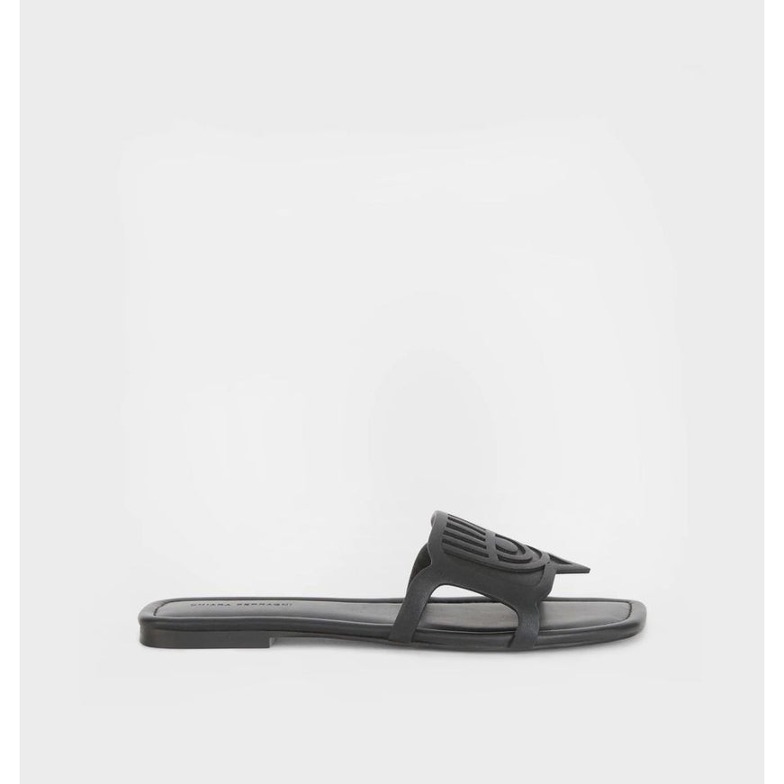 a pair of black sandals on a white background