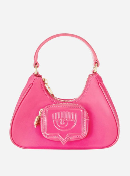 a pink handbag with a smiley face on it