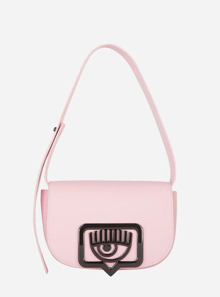 a pink handbag with an eye on the front