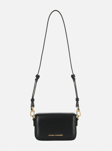 a black handbag with a chain strap