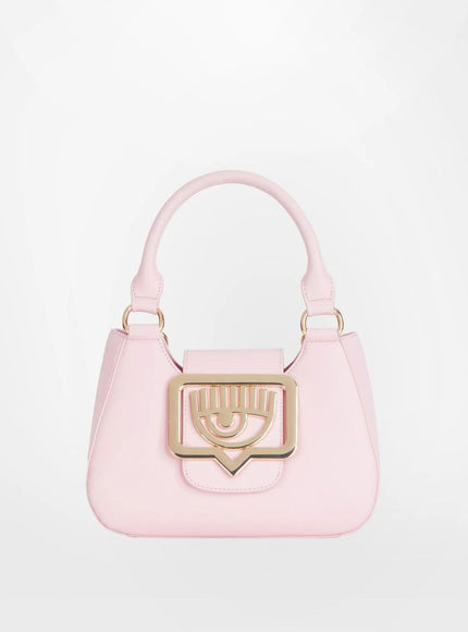 a pink handbag with a gold handle