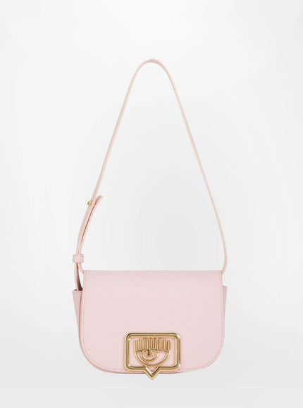 a pink purse with a heart on the front