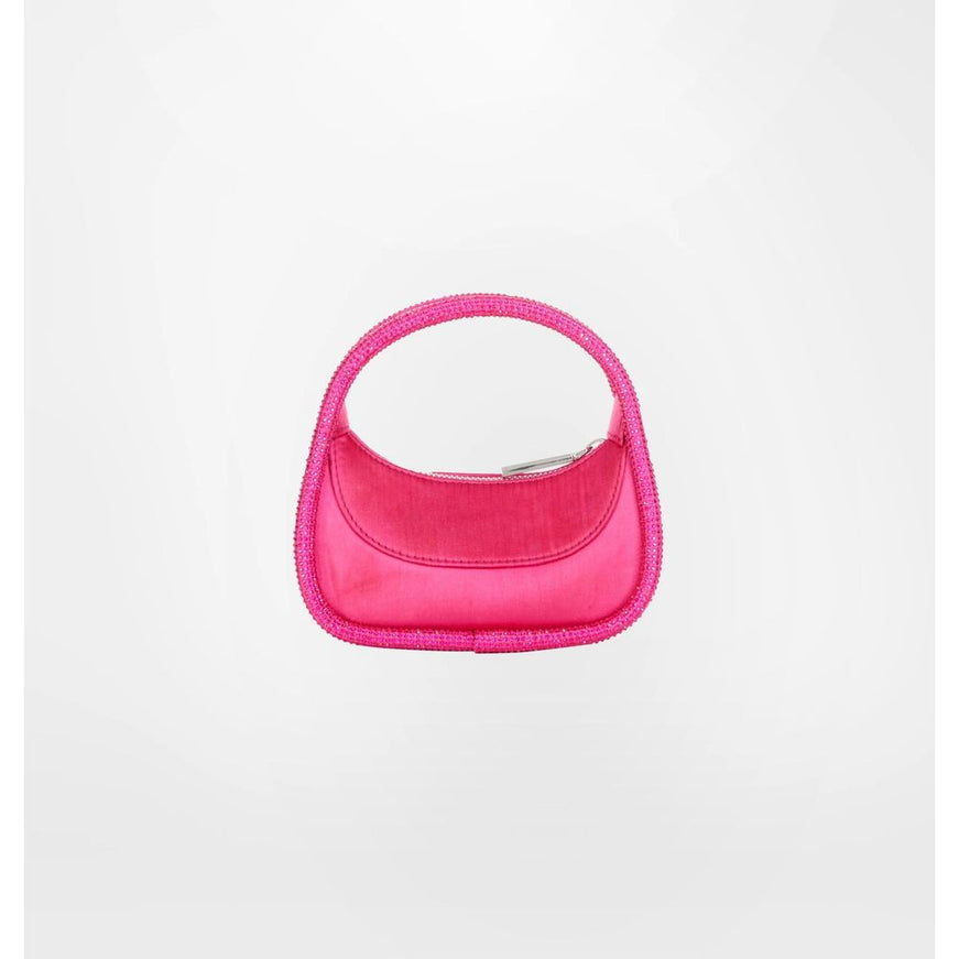 a pink handbag is hanging on a white wall