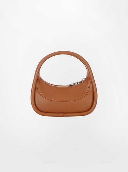 a brown handbag on a white background