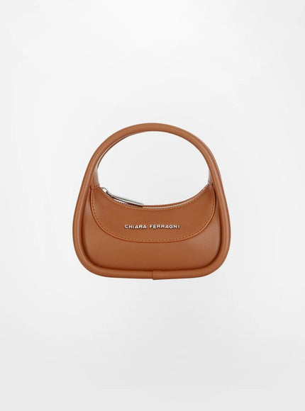 a brown handbag on a white background