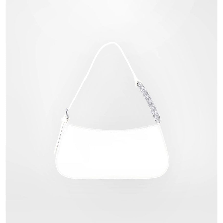 a white purse hanging on a wall