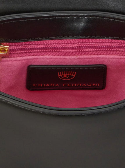 a close up of a pink and black bag