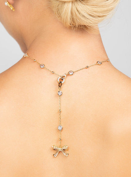 Ryan Crystal and Pearl Bow Charm Lariat Necklace