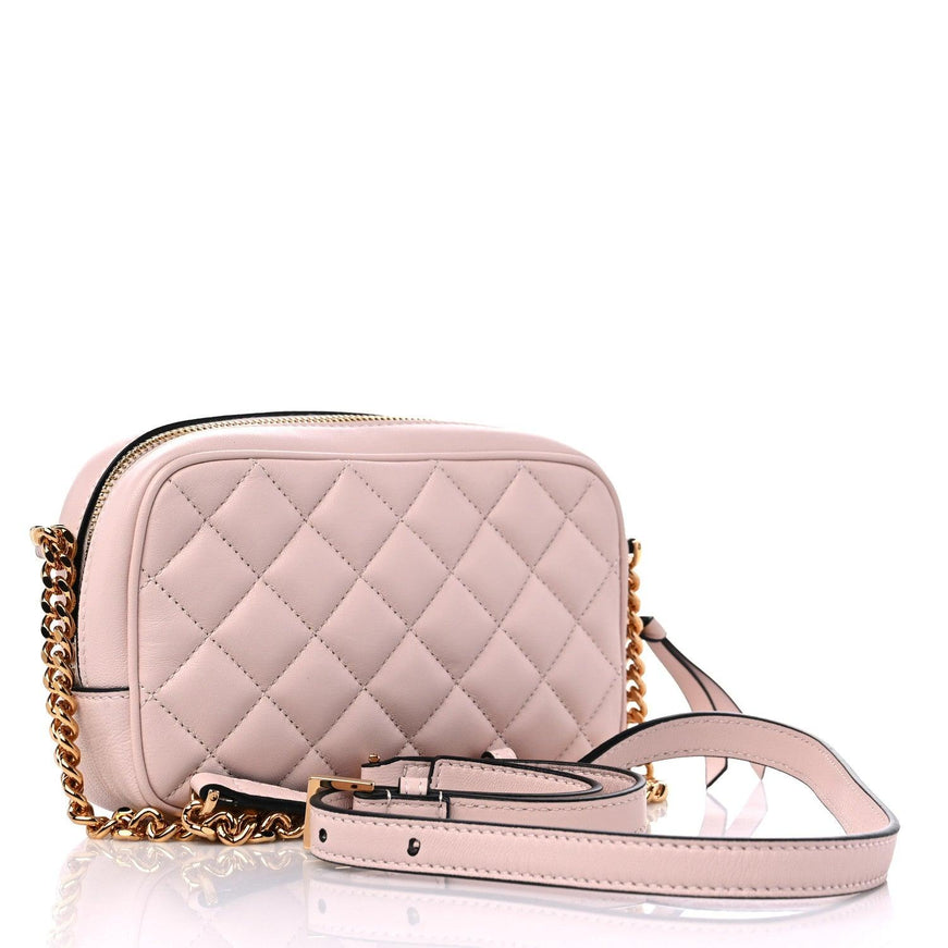 Back view of Versace quilted Medusa Icon camera bag in powder pink